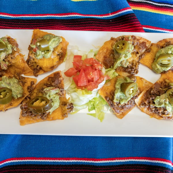 Town House Restaurant's Tex-Mex nachos with ground beef, guacamole, jalapeños, lettuce, and diced tomatoes.